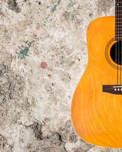 High angle view of guitar on floor