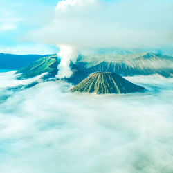 View of volcanic landscape against cloudy sky