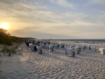 Scenic view of beach against sky during sunset