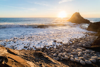 Scenic view of sea against sky during sunset