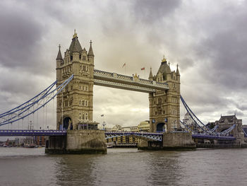 Low angle view of tower bridge over thames river in city