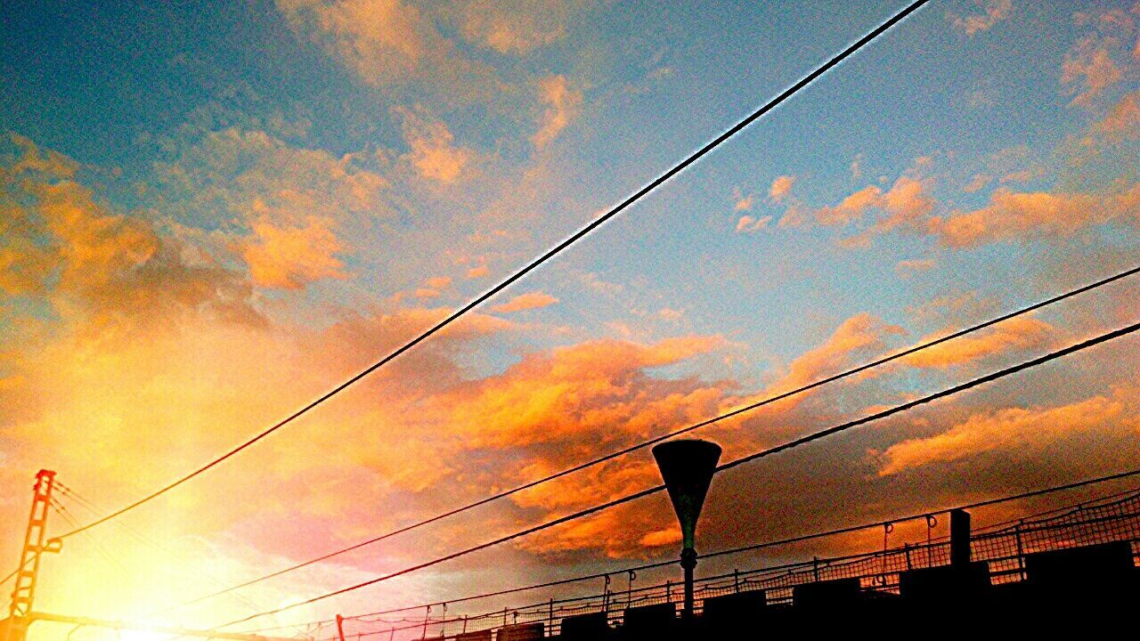 power line, connection, cable, low angle view, sky, sunset, electricity pylon, power supply, electricity, silhouette, cloud - sky, power cable, cloud, cloudy, technology, fuel and power generation, orange color, dusk, built structure, outdoors