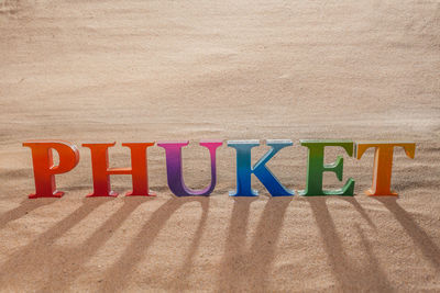 Text written on sand at beach