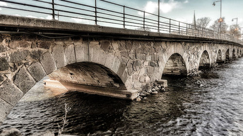 Bridge over river against sky