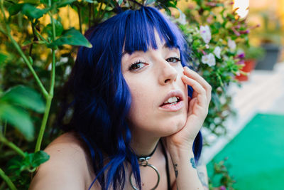 Photo of adorable young woman making selfie outdoors backyard