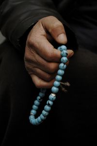 Close-up of hand holding cross