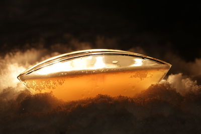 Close-up of illuminated light reflection in water