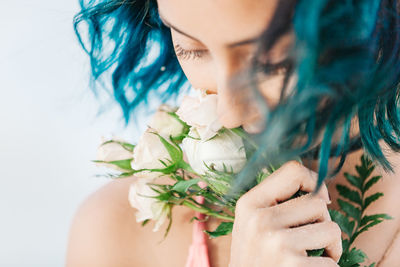 Close-up of woman with flowers in hair