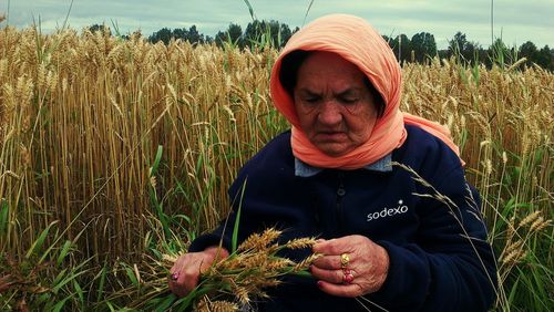 Portrait of mature man standing in field