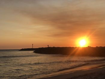 Scenic view of sea against sky during sunset