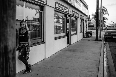 Woman standing on city street