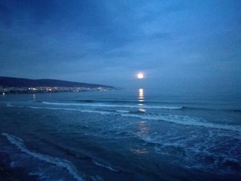 Scenic view of sea against sky at night