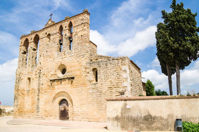 Low angle view of historical building against sky