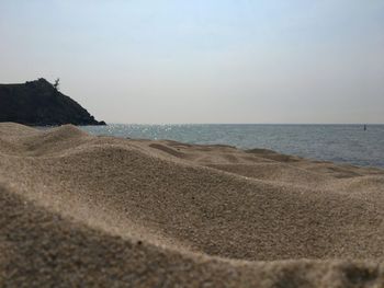 Scenic view of beach against clear sky