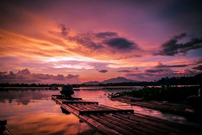 Scenic view of lake against orange sky