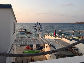 Scenic view of swimming pool by sea against sky