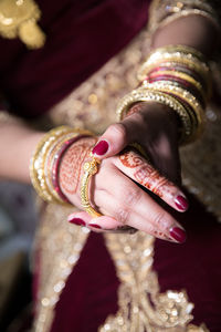 Midsection of bride wearing bangle