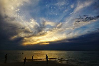 Scenic view of beach against sky during sunset