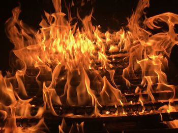 Close-up of fire burning at night