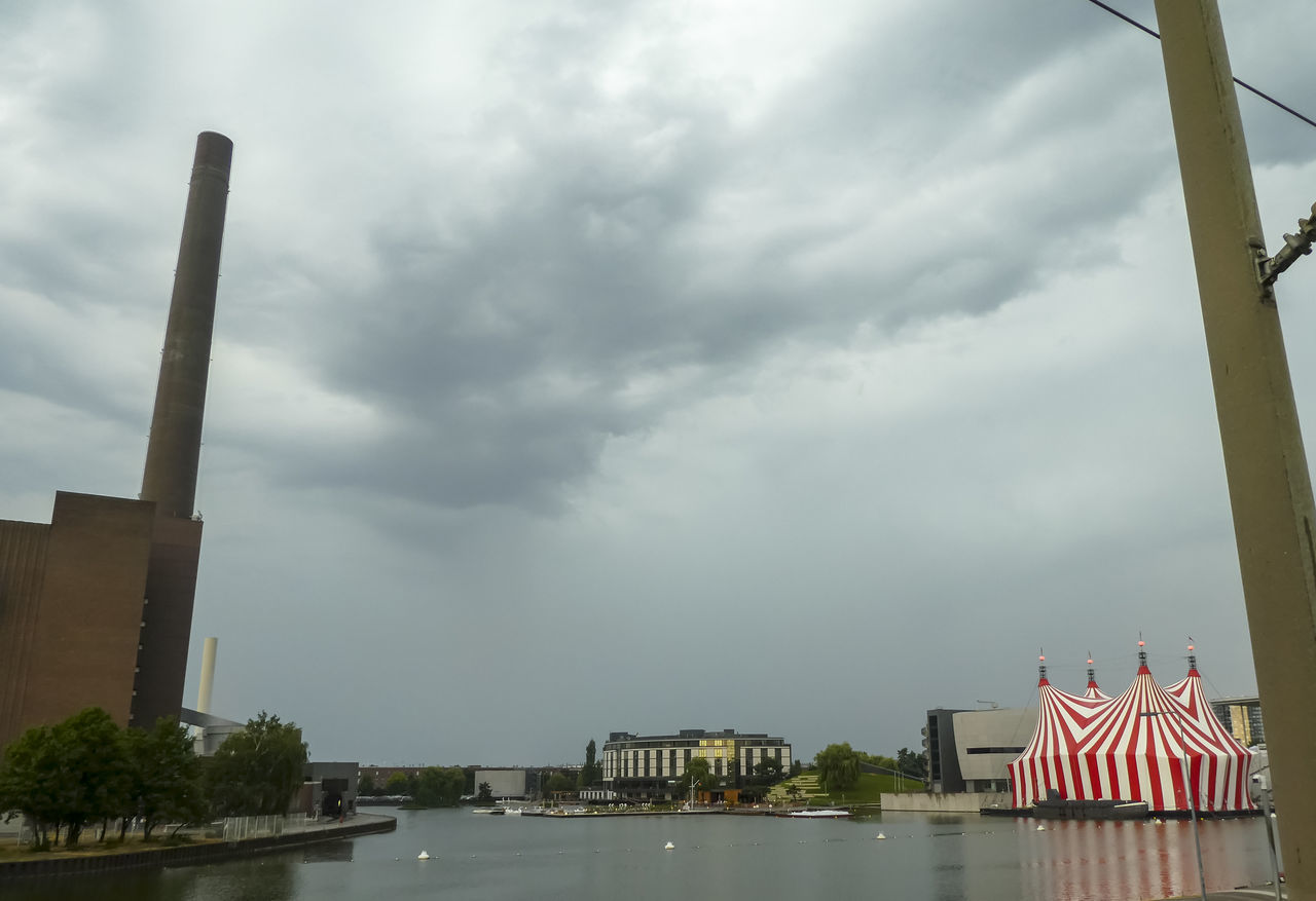 BUILDINGS AGAINST CLOUDY SKY