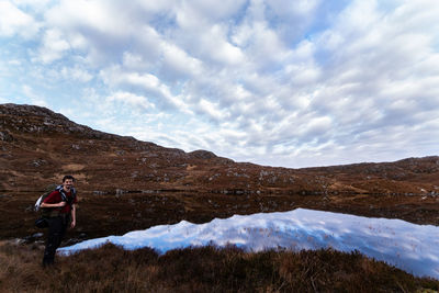 Full length of man on mountain against sky
