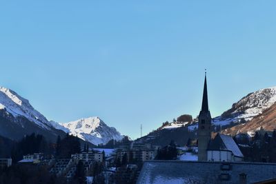 View of town against clear blue sky