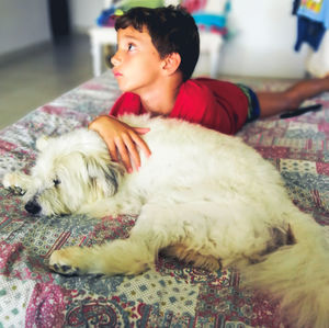 Woman with dog relaxing at home