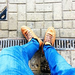 Low section of man standing on floor