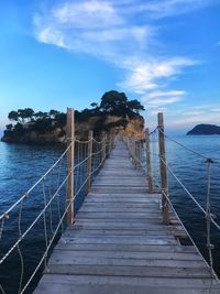 Pier over sea against sky