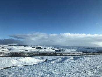 Scenic view of sea against sky during winter