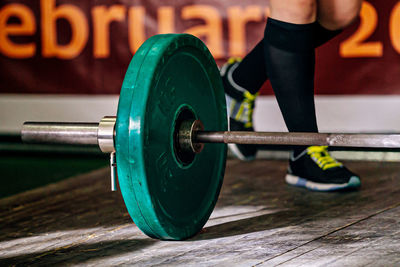 Midsection of man exercising in gym