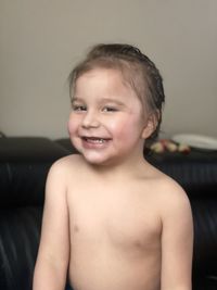 Portrait of shirtless boy at home