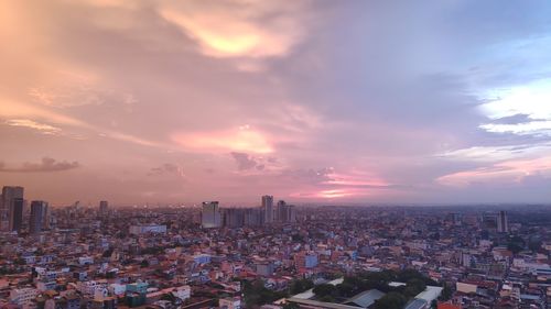 High angle view of buildings against sky during sunset