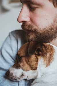 Close-up of man with dog
