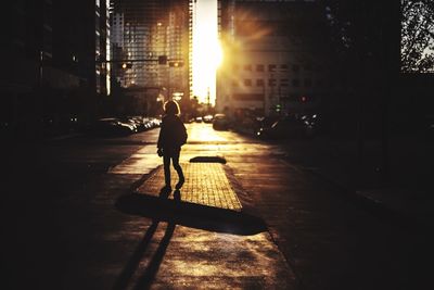 Person walking on street in city