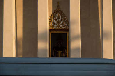 Low angle view of statue against building