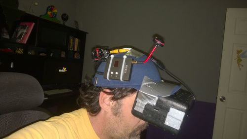 Young woman photographing in room