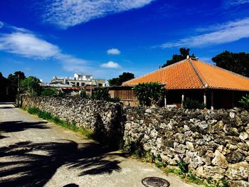 Houses against blue sky and clouds