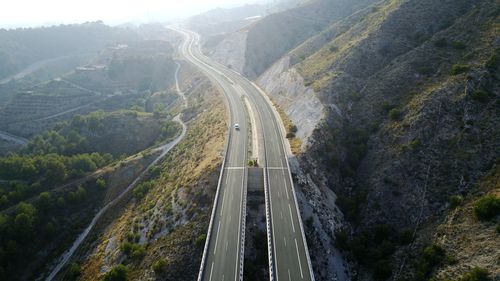 High angle view of road amidst mountains against sky