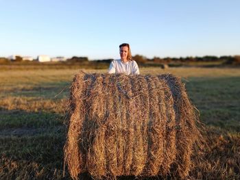 Man standing on hay