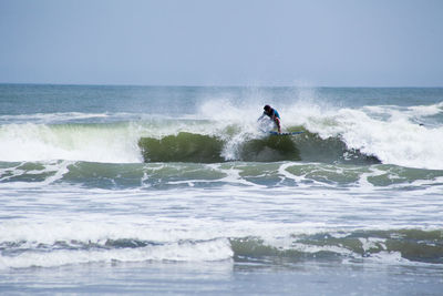 People surfing in sea