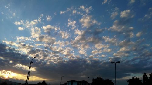 Low angle view of silhouette trees against sky at sunset