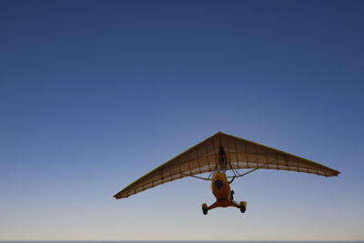 Gliding in a mini plane in a low angle view. 