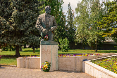 Statue against trees in park