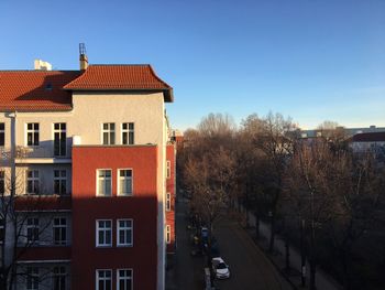 Buildings against blue sky and clouds