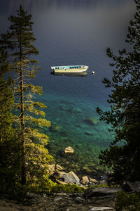 High angle view of boat floating on lake