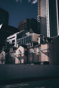 Low angle view of buildings against sky in city