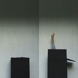 Man with umbrella on wall