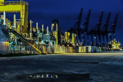 Panoramic view of construction site against sky at night