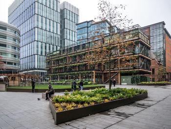 Modern buildings in city against sky